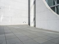 the outside walkway has a little black skateboarder doing tricks on it, and a large building that's just beside it