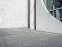 the outside walkway has a little black skateboarder doing tricks on it, and a large building that's just beside it