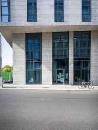 a couple of windows are on the building next to it's sidewalk with post it notes