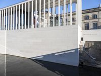 the front of an opera is built on the roof of a building with stairs leading up to it