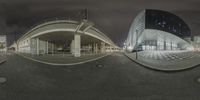 two different pictures of an outdoor mall at night taken in the fish eye lens with full view of its front entrance