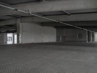 a car sits in a empty parking garage for a few hours and is open to traffic