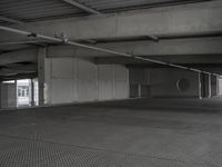 a car sits in a empty parking garage for a few hours and is open to traffic