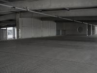 a car sits in a empty parking garage for a few hours and is open to traffic