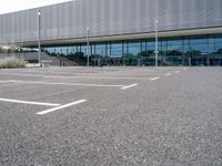 the parking lot near the building is empty for everyone to see in its picture,