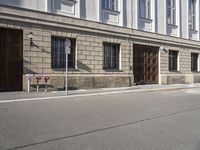 a street corner with building front and parking meter in front of it to the right