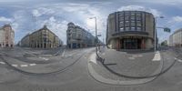 some street and buildings in reflection from a fish eye lens, on a sunny day