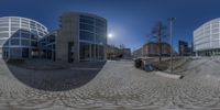 a full - view photo of a sphere photograph taken on a street corner with three buildings