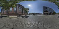 the view from outside the spherical lens of a building on the other side of a road