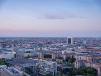 the view of berlin, taken from atop the eiffel tower in germany at dusk