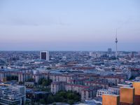 the view of berlin, taken from atop the eiffel tower in germany at dusk