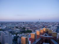 the view of berlin, taken from atop the eiffel tower in germany at dusk