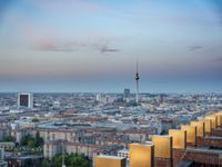 the view of berlin, taken from atop the eiffel tower in germany at dusk