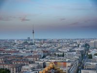 the view of berlin, taken from atop the eiffel tower in germany at dusk