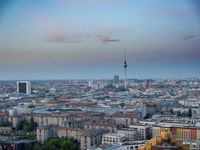 the view of berlin, taken from atop the eiffel tower in germany at dusk