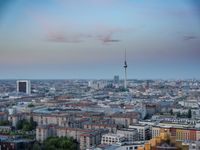 the view of berlin, taken from atop the eiffel tower in germany at dusk