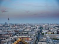 the view of berlin, taken from atop the eiffel tower in germany at dusk