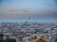 the view of berlin, taken from atop the eiffel tower in germany at dusk