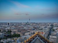 the view of berlin, taken from atop the eiffel tower in germany at dusk