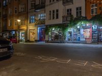 an empty city street at night in front of a bookstore shop with the words sex and hate written on the pavement