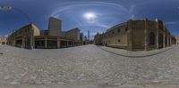 an image of a cobblestone street taken in a fish eye lens like object