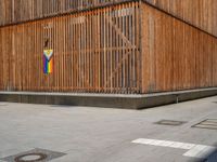 a group of people riding skateboards near wooden panels and stairss with artwork on them