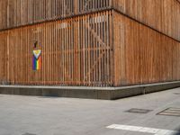 a group of people riding skateboards near wooden panels and stairss with artwork on them