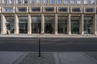 there is an outside place with a street sign in front of a building with windows