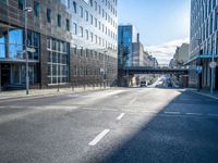 empty street with modern office buildings in background on sunny day in city skylines and business district