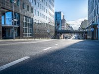empty street with modern office buildings in background on sunny day in city skylines and business district