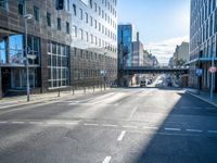 empty street with modern office buildings in background on sunny day in city skylines and business district