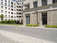 a paved area in the middle of a bricked - up courtyard is pictured here