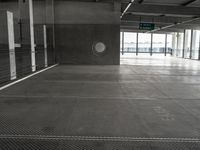 empty metal parking garage with lots of stalls and no cars inside it for storage or transportation