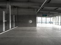 empty metal parking garage with lots of stalls and no cars inside it for storage or transportation