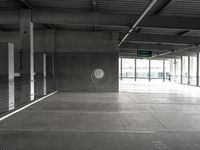 empty metal parking garage with lots of stalls and no cars inside it for storage or transportation