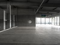 empty metal parking garage with lots of stalls and no cars inside it for storage or transportation