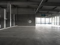 empty metal parking garage with lots of stalls and no cars inside it for storage or transportation