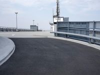 a boat is parked in an empty parking lot near an air port on the water