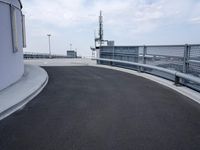 a boat is parked in an empty parking lot near an air port on the water