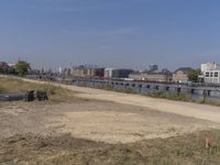 the city is clean and empty by the water with no people or cars nearby,