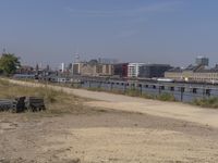 the city is clean and empty by the water with no people or cars nearby,