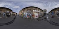 three 3d renderings of different buildings on a street and street with graffiti covering the walls