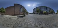 two circular panoramas of the same area from different angle and angle and one is looking at the street