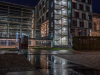 Berlin's Urban Nightscape: A Wet Cobblestone Path