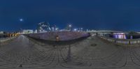 an image of a fish eye lens panoramic view of some buildings on the waterfront