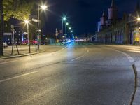 the night view of a dark city street from a very empty area of focus on the vehicle