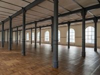 a large open room with wooden flooring and exposed ceilings in it is clean, well lit and ready to be used as an office