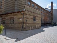 this is an image of a brick building with a parking meter on it's side