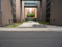 an open air gate outside a building next to a street and trees in a city