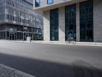 a bike in front of an office building and another building behind it with buildings on either side